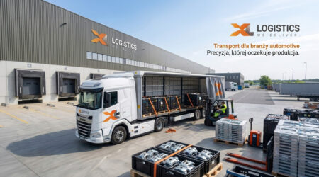 White DAF truck with orange XL logo unloading at a loading dock of an industrial warehouse; forklift loading pallets nearby.
